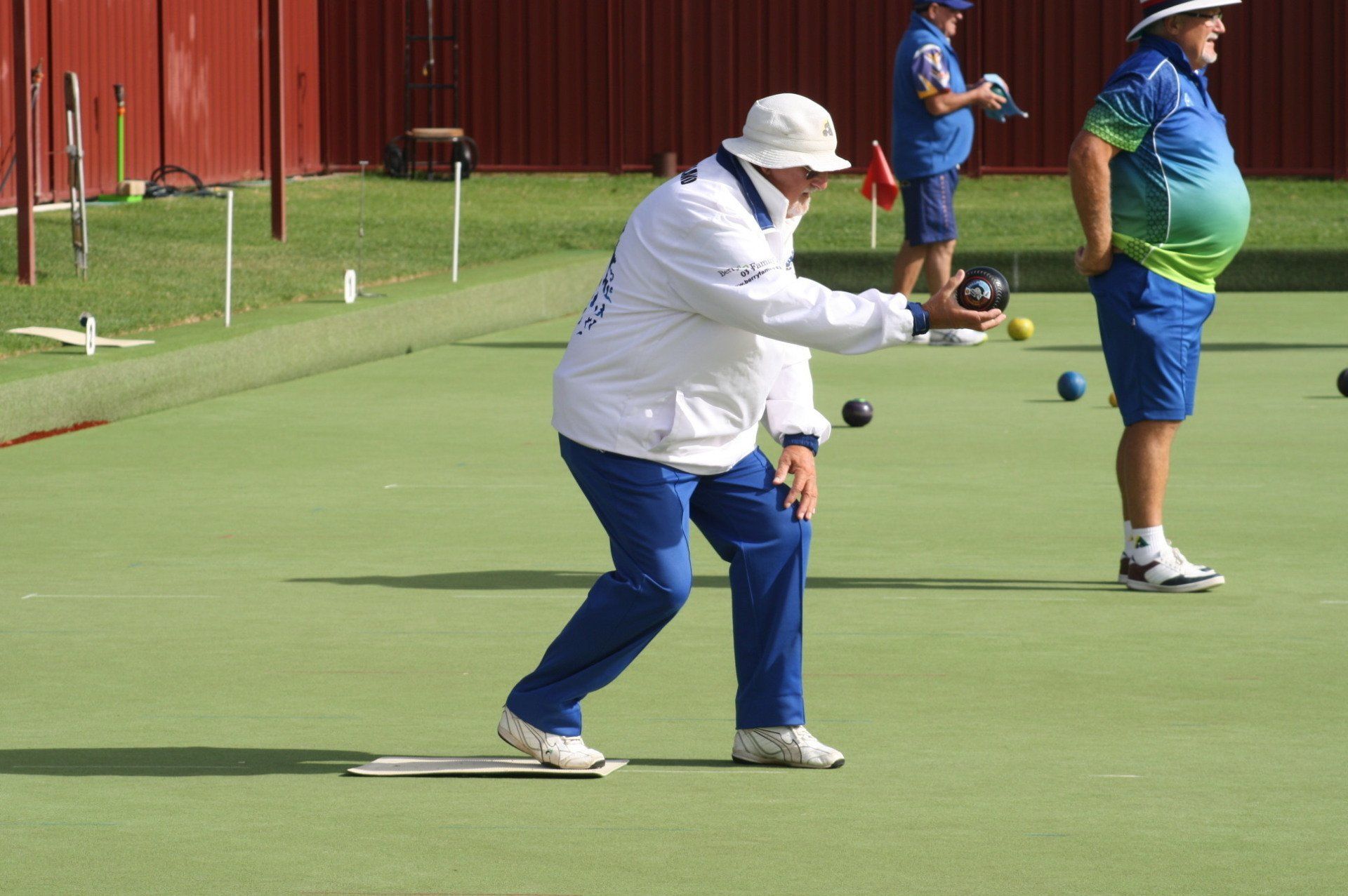 Bowler preparing a delivery during lawn bowls