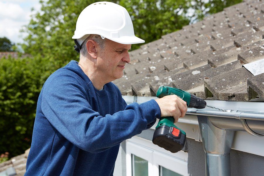 old man wearing white hardhat