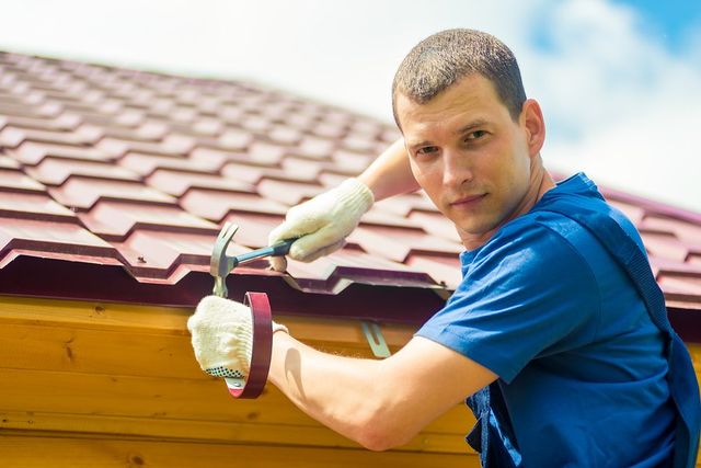 a man holding hammer