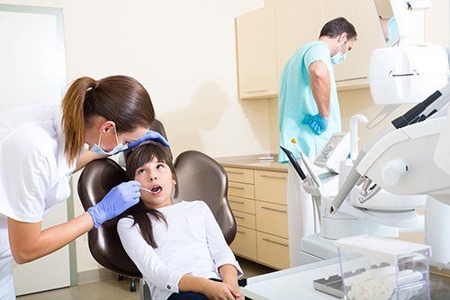 Little girl undergoing a dental checkup