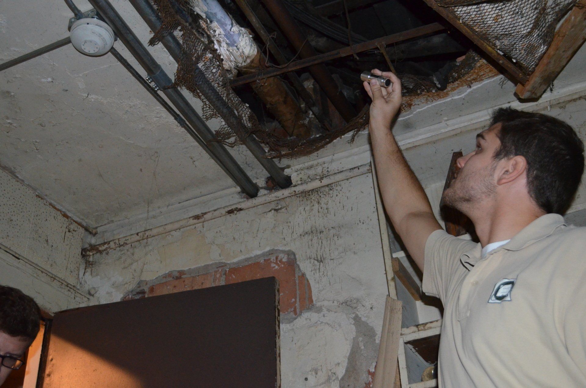 ECG employee checking for asbestos
