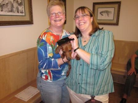 women holding a dog