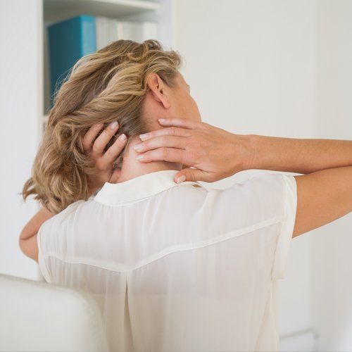 Pain In Neck — Businesswoman Rubbing Her Aching Neck in Concord, CA Pain In Neck — Businesswoman Rubbing Her Aching Neck in Concord, CA