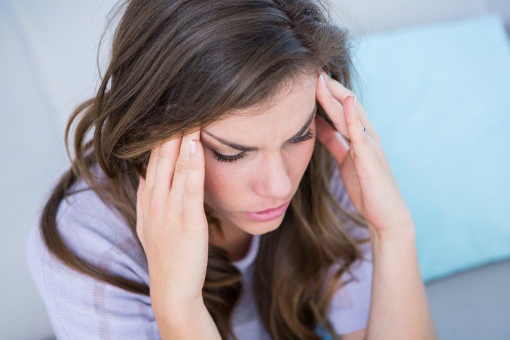 Headaches — Woman Suffering From Migraine At Home in Concord, CA Headaches — Woman Suffering From Migraine At Home in Concord, CA
