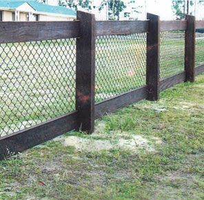 dark wood rail fence with chainwire