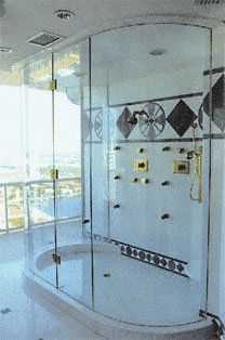 Shower enclosure in white bathroom