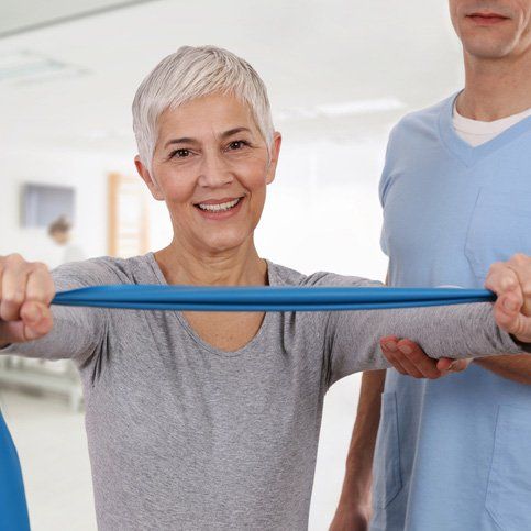 Chiropractic Services — Woman Having Chiropractic Back Adjustment in Dodge City, KS