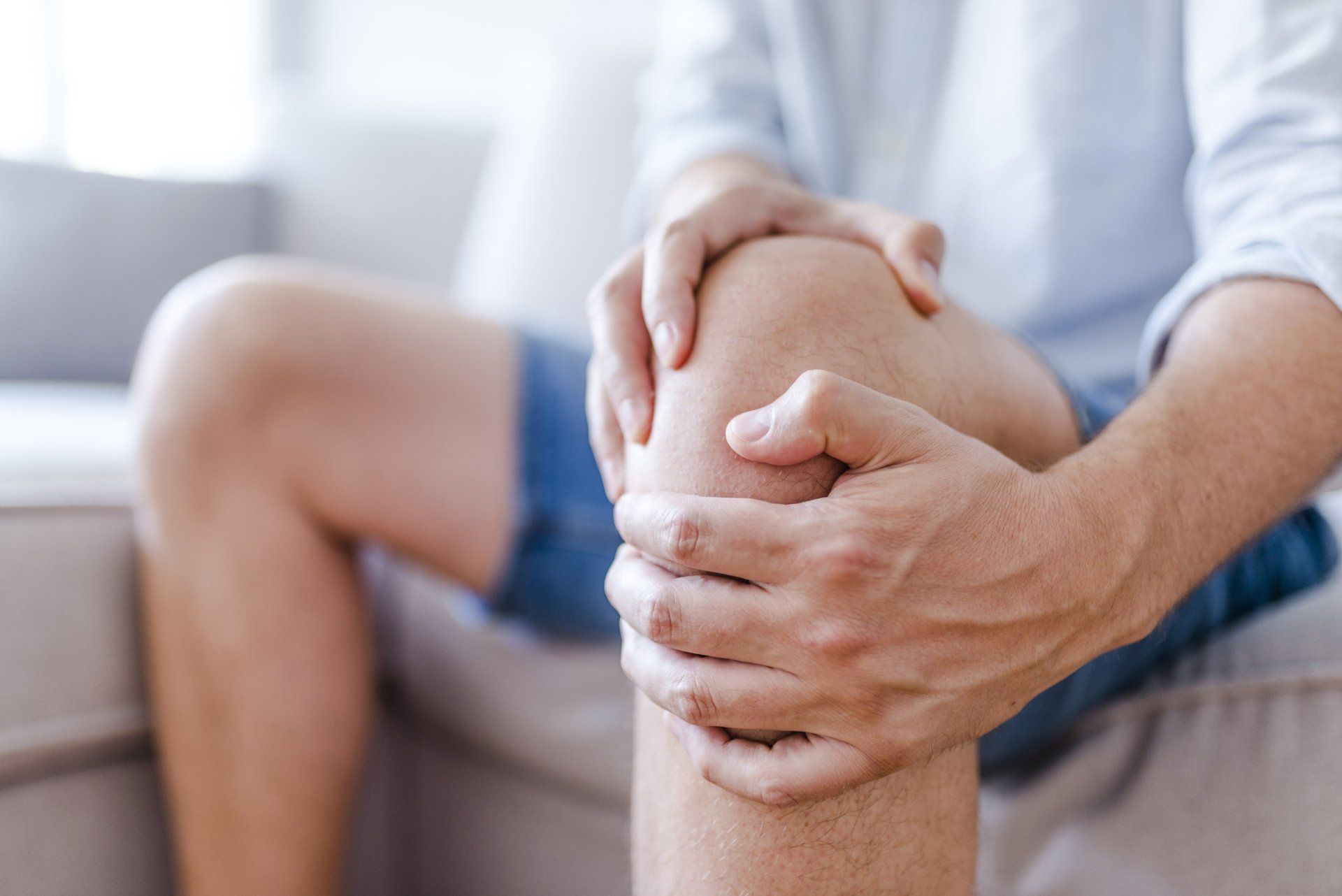 Man Suffering From Knee Pain — Dodge City, KS — Phillips Chiropractic & Physical Therapy Center