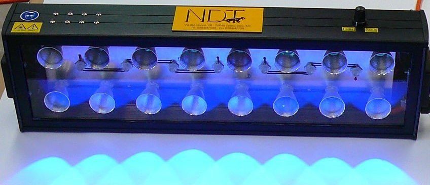 A blue light is shining on a white surface