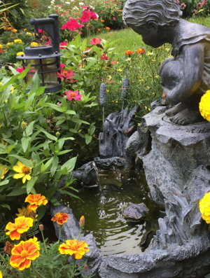 Fountain in Garden - Story writer in Bradley, ME