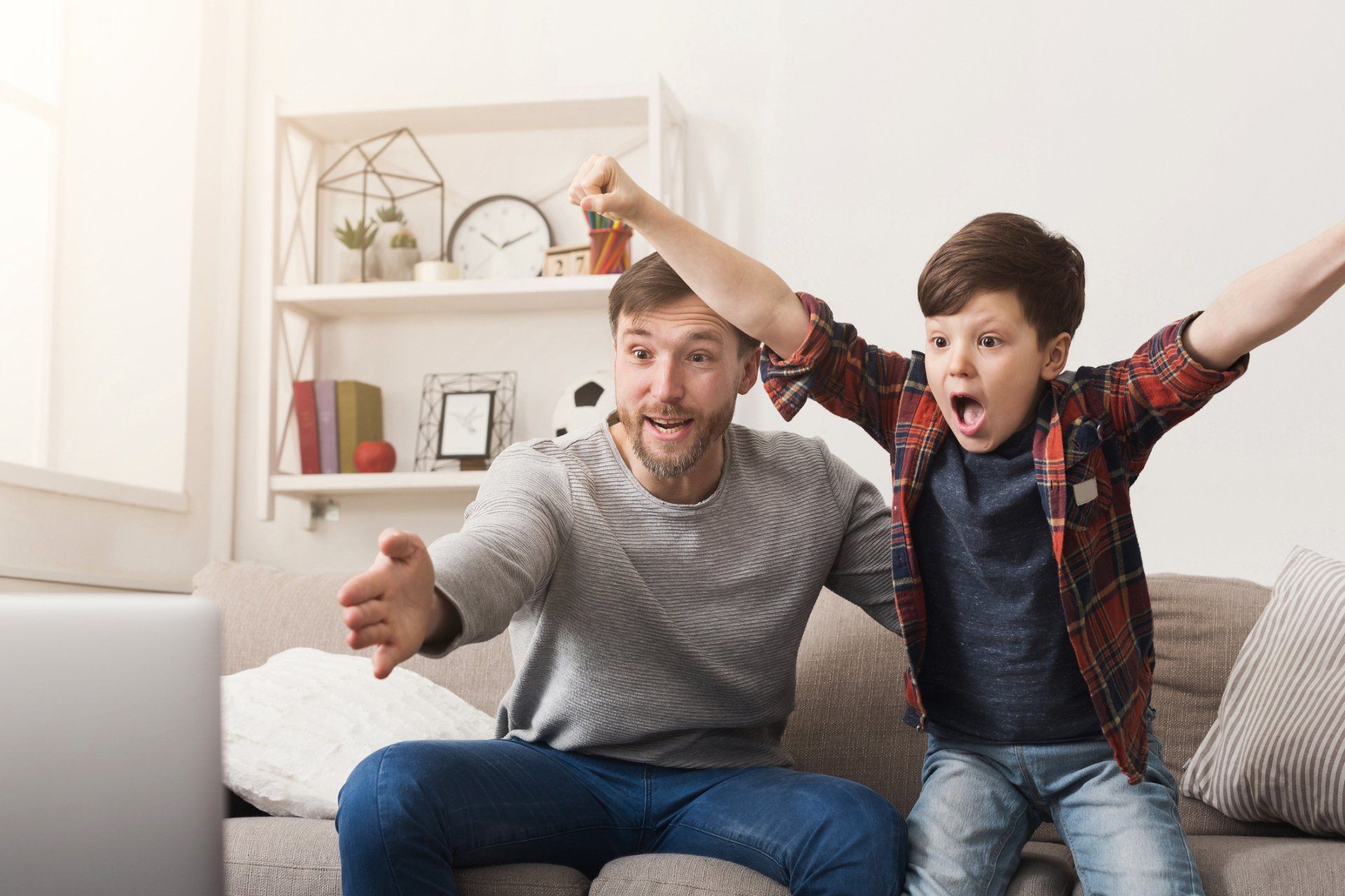 father and son cheering
