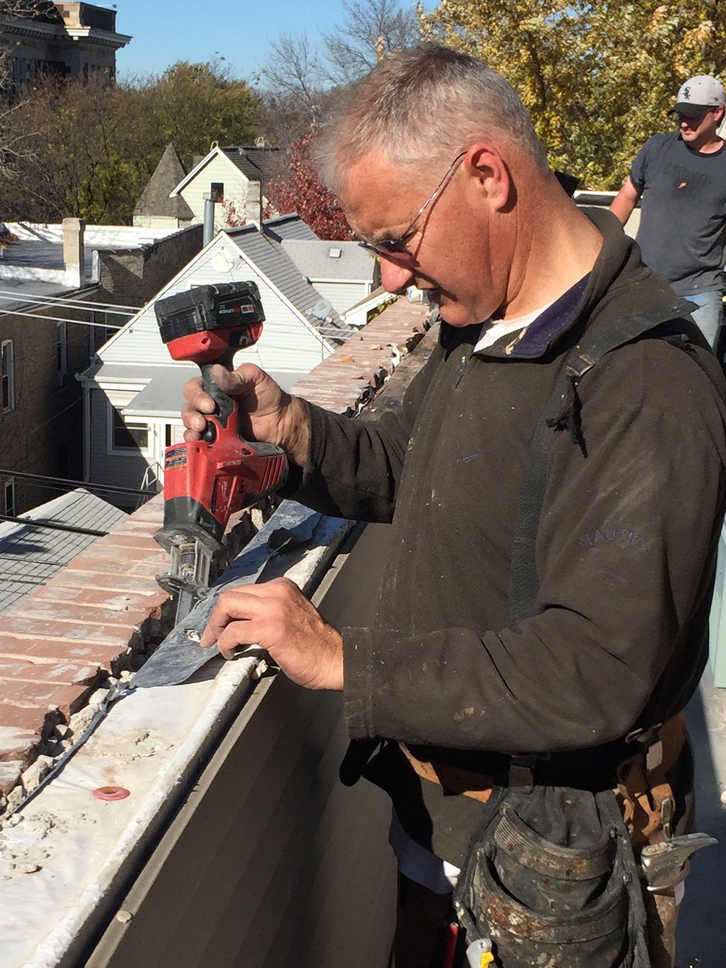 WickRight Parapet Vent inventor Bob Kelly preps parapet wall for parapet vent installation.