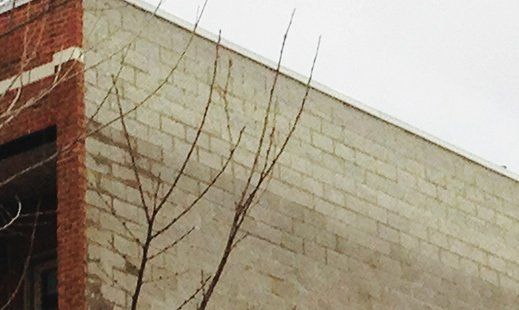 Transition of water moving out of masonry via WickRight parapet vent installation on Diversey in Lakeview, Chicago