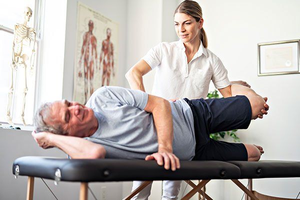 Worker with Senior Client — Springfield, MO — James River Chiropractic & Wellness Worker with Senior Client — Springfield, MO — James River Chiropractic & Wellness