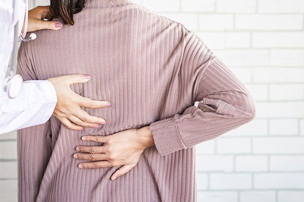 Doctor Examining a Patient — Springfield, MO — James River Chiropractic & Wellness