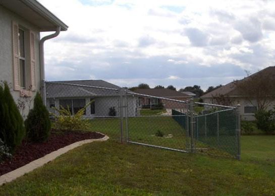 Green vinyl 4 foot with galvanized frame installed on a hill