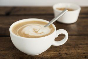 a frothy cup of heavy cream coffee