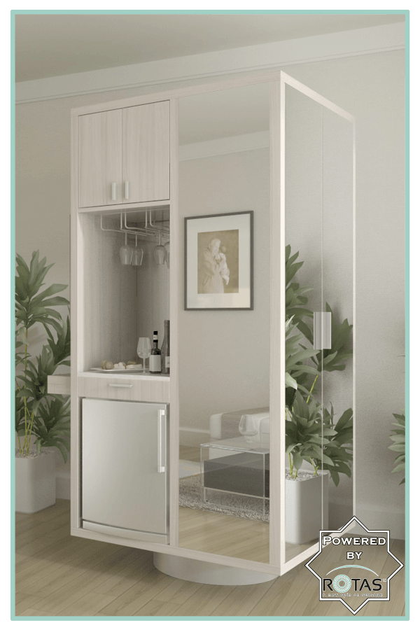 A room with a mirrored wall and a refrigerator
