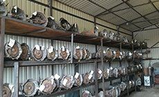Car Engines — Rack of Car Transmissions in Del City, OK