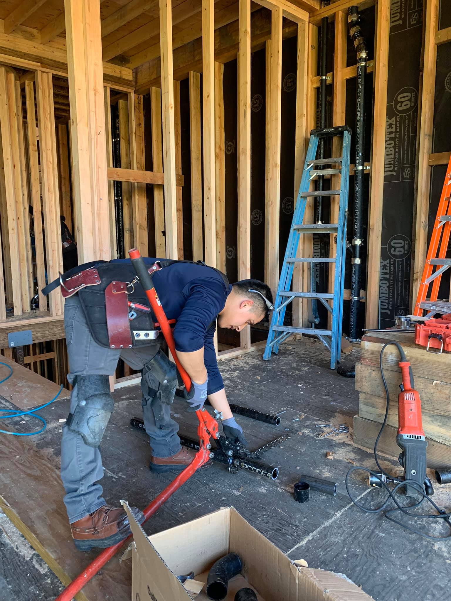 Man Cutting Plumbing Pipes — San Francisco, CA — Bayworks Plumbing