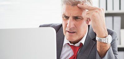 man staring at screen - digital marketing agencies often don't give you transparency