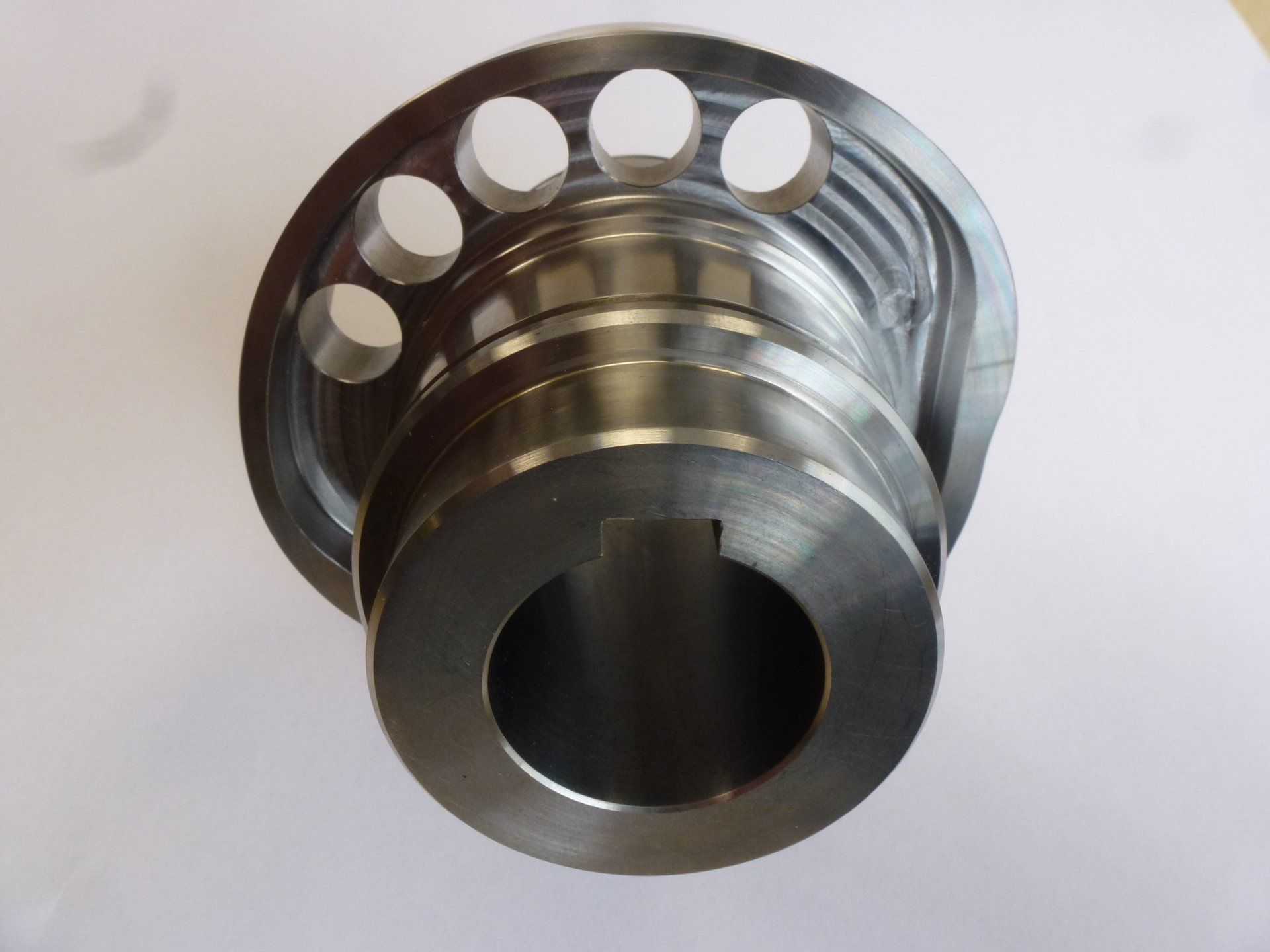 A close up of a metal object with holes in it