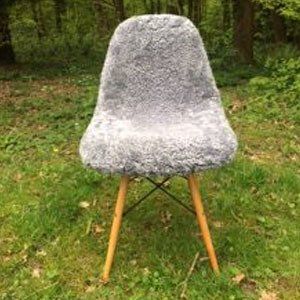 SHEEPSKIN EAMES STYLE CHAIR.