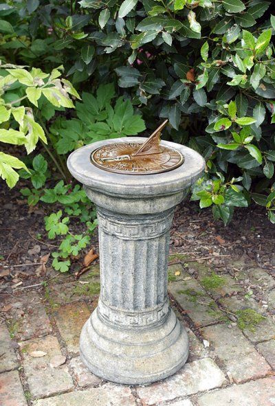 stone garden statue small aged brass sundial