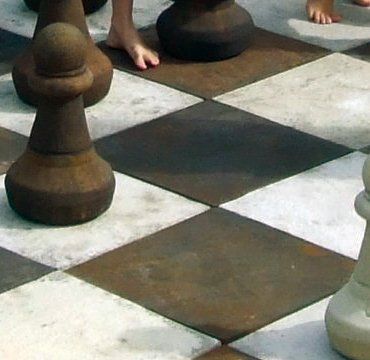 stone garden statue chess board square rust