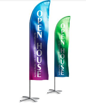 Two tall feather flags reading “OPEN HOUSE,” one blue-purple and one green, on metal bases.