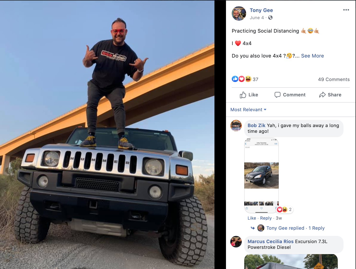A man is standing on top of a hummer.