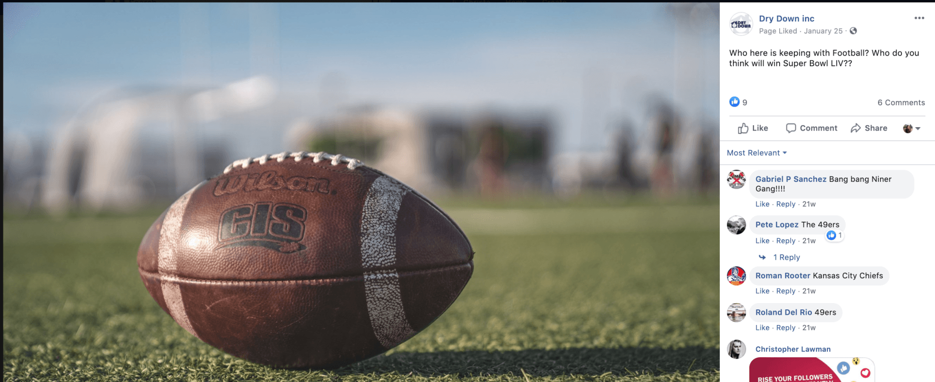 A football is sitting on top of a lush green field.
