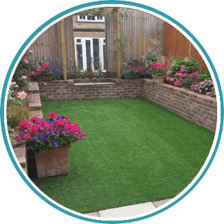 New turf being laid for a new lawn in Cobham by Brodie & Hickin Landscapes