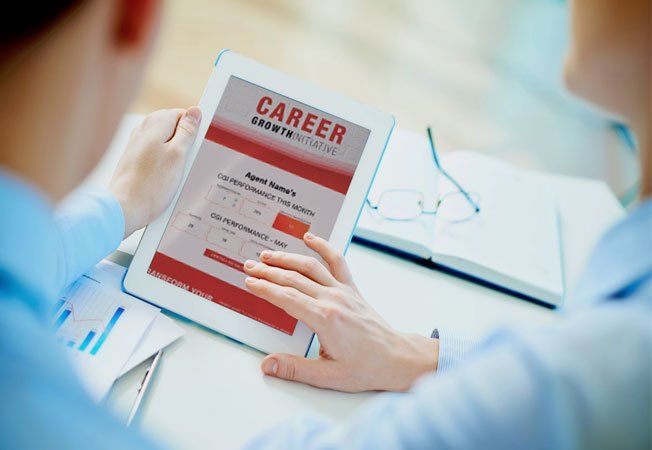 A person is looking at a tablet with a career page on it.