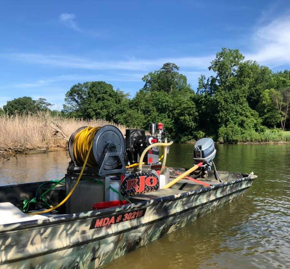 Aquatic Weed Control — Boat With Aquatic Weed Control Machine in Glen Burnie, MD Aquatic Weed Control — Boat With Aquatic Weed Control Machine in Glen Burnie, MD