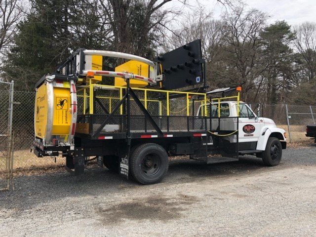 Commercial Tree Removal — White Crash Attenuator Truck in Glen Burnie, MD Commercial Tree Removal — White Crash Attenuator Truck in Glen Burnie, MD
