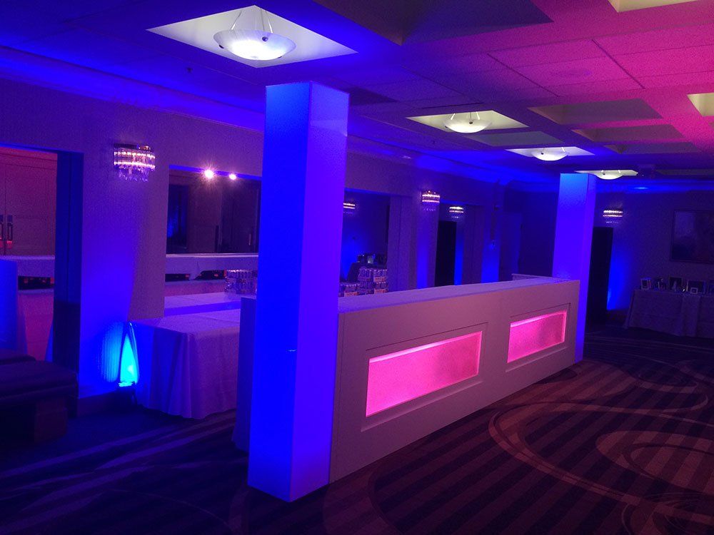 a room with purple and blue lights on the walls