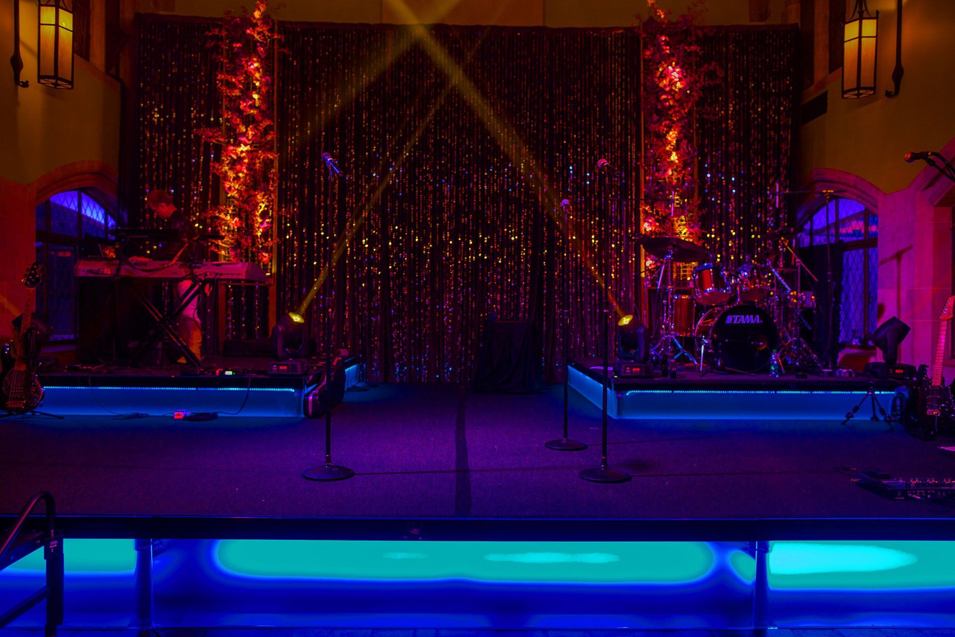 a stage with a drum set that says tama on it