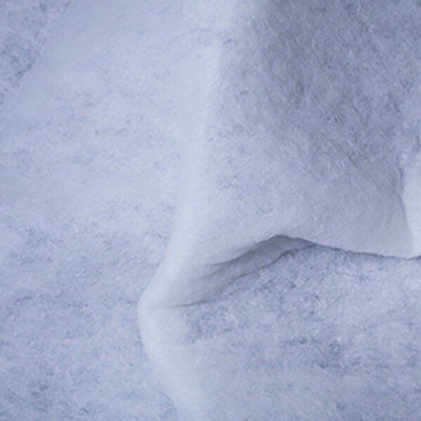 White, fluffy, textured fabric folded over on itself.