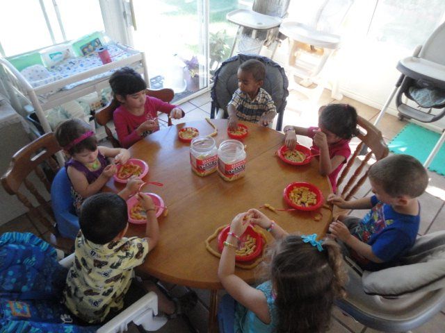 Children making Mother's Day crafts