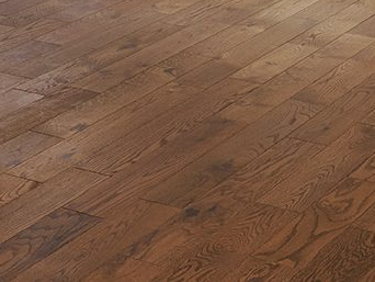 A close up of a wooden floor in a room.