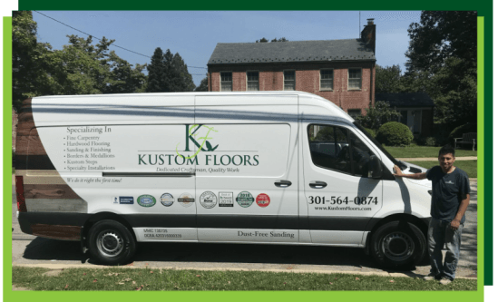 A man standing next to a white van that says kustom floors