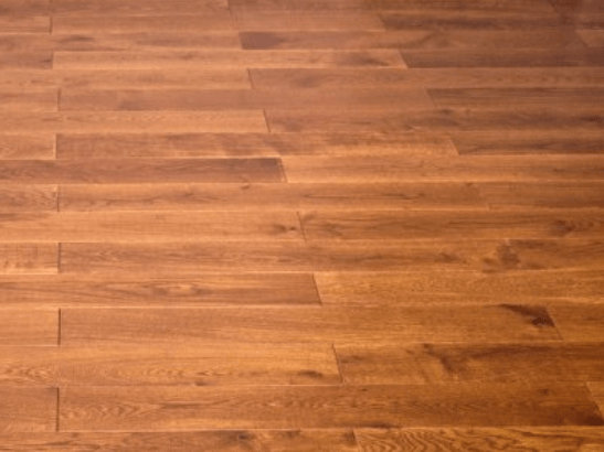 A close up of a wooden floor with a lot of lines