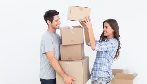 Men and Women Lifting Boxes — Storage Units in La Pine, OR