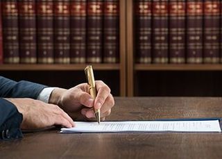 Lawyer Writing on Legal Documents — Estate Planning in Sacramento, CA Lawyer Writing on Legal Documents — Estate Planning in Sacramento, CA