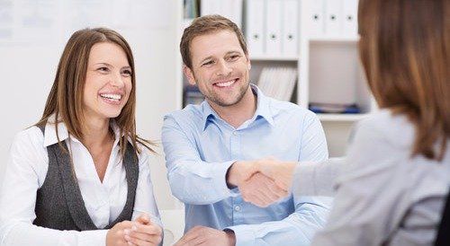 Accounting professional discussing the payroll report with clients