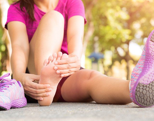 Runner holding sore foot
