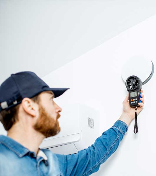 Man Checking the Air Ventilation — Zachary, LA — Hughes Mechanical Contractors