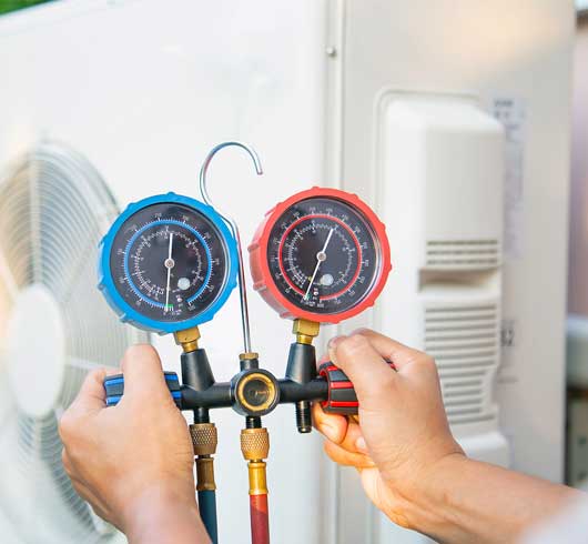 Worker Checking the Air Condition — Zachary, LA — Hughes Mechanical Contractors