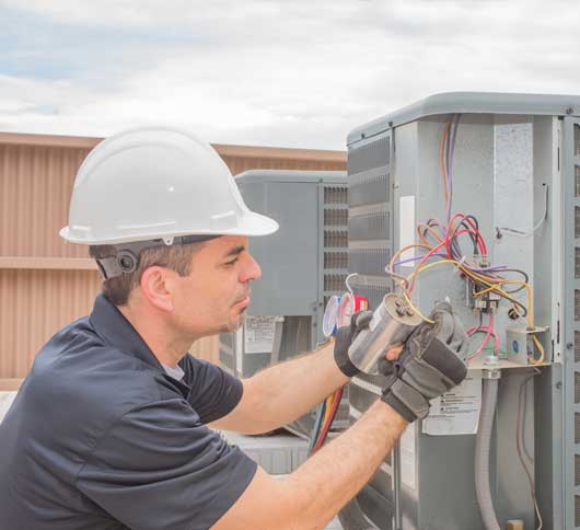 Technician Repairs the Condensing Unit — Zachary, LA — Hughes Mechanical Contractors